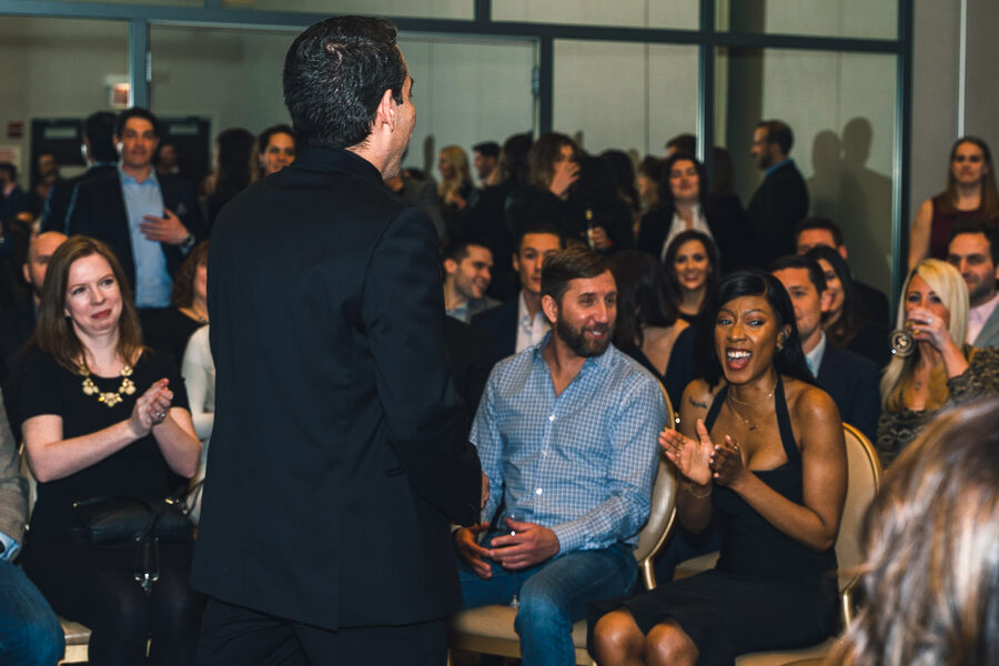 Corporate event close-up magician Gozner engaging a Chicago audience