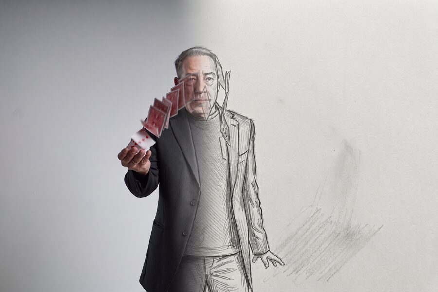 Gozner portrait dissolving into a pencil sketch, holding a fan of cards